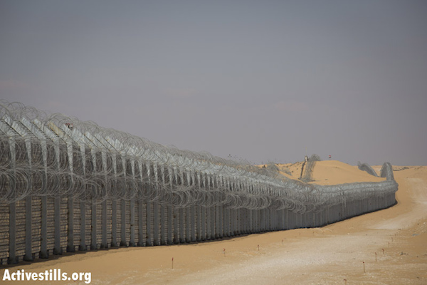 The fence Israel built along the Egyptian border to keep African asylum seekers from crossing into Israel. In the first year since its completion, the number of asylum seekers crossing into Israel dropped from over 10,000 to a mere 43. (Photo: Activestills.org)