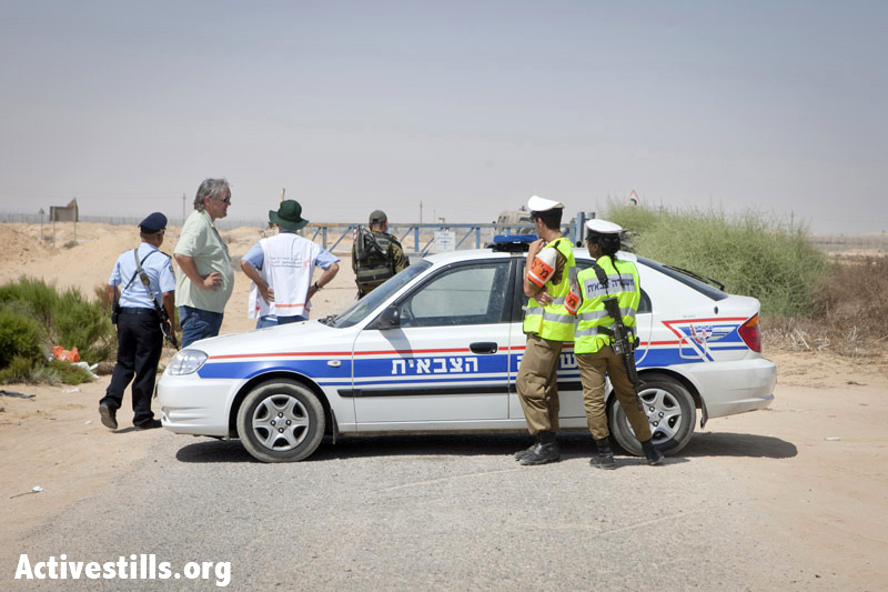 Israeli military police prevent a delegation from Physicians for Human Rights from entering the border zone where African refugees are being held on Israel's southern border, September 6, 2012. About 20 Eritrean refugees, including a 14-year-old child, were trapped between fences on the Israel-Egypt border for one week without food and water. Eventually Israel let in two women and the child but turned the others around back into Egypt. (Photo by: SG/Activestills.org)