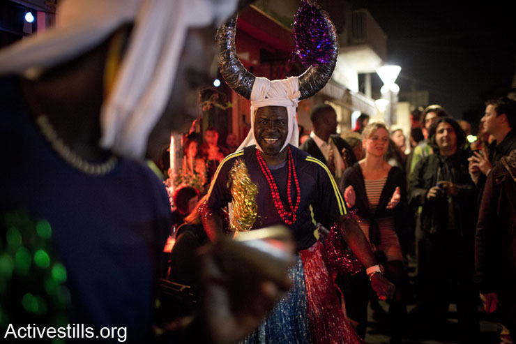 African asylum seekers preform during a cultural solidarity event in the Shafa Bar, Jaffa, January 19, 2014. Thirty bars, restaurants and clubs in Tel Aviv took part in cultural solidarity events in which African culture was celebrated with the African asylum seekers community in Israel. Most of the venues employ African asylum seekers in maintenance work. (photo: Oren Ziv/Activestills.org)