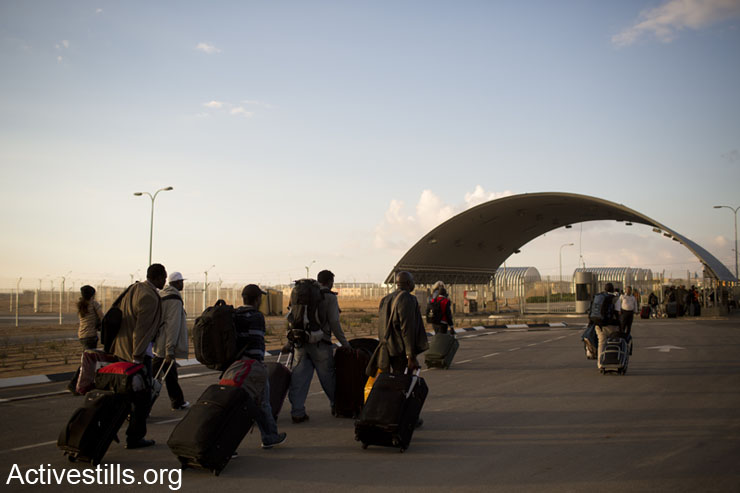 African asylum seekers walk into the Holot detention center in Israel's southern Negev desert, on February 17, 2014.