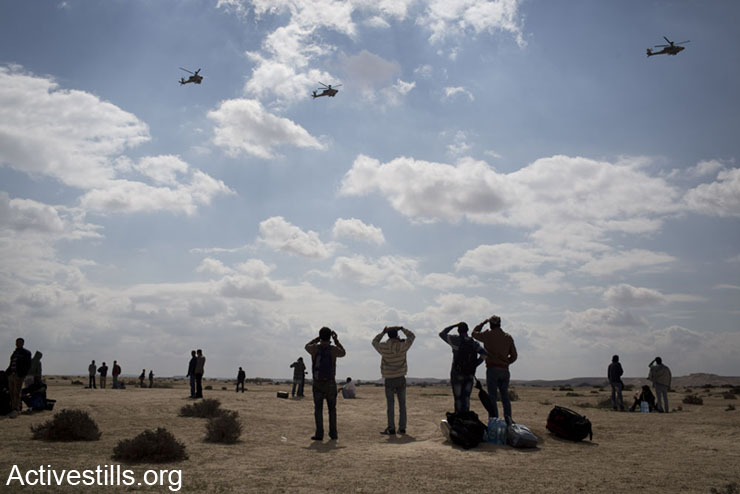 African asylum seekers take part in a protest outside the Holot detention center, in Israel's southern Negev desert, February 17, 2014. 