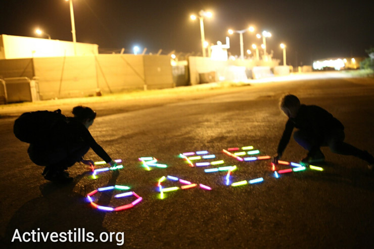 Female Israeli anti-occupation activists protest the siege on Gaza at the Erez Crossing on International Women's Day. (photo: Activestills)