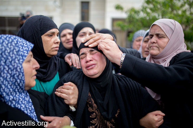 The mother of of Saji Sayel Darwish who was shoot last night by Israeli soldier on a road to Ramallah on March 11, 2014 in Beitin, West Bank. According to media reports the family rejects Israeli military claims alleging he threw stones at settlers' vehicles, and that such claims are only meant to justify the cold-blooded murder of their son.