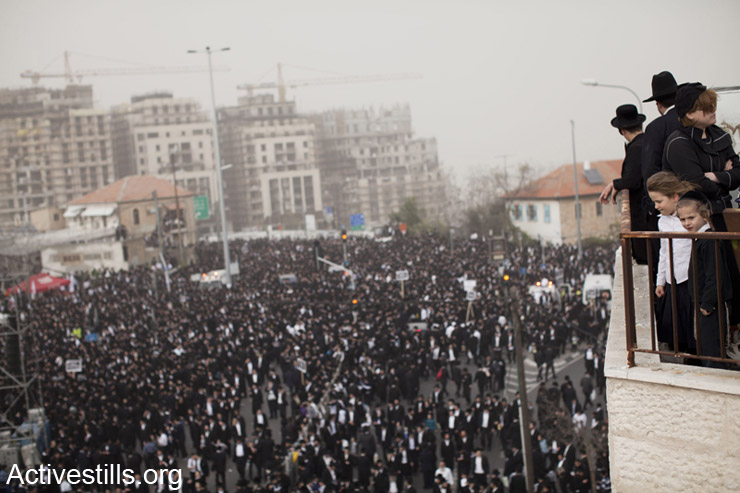 Ultra-Orthodox Jewish men and women take part in a mass prayer in Jerusalem March 2, 2014. Hundreds of thousands of ultra-Orthodox Jews held a mass prayer in Jerusalem on Sunday in protest against a bill meant to slash military exemptions granted to seminary students, a tradition held since the founding of Israel. (photo: Tali Mayer/Activestills.org)