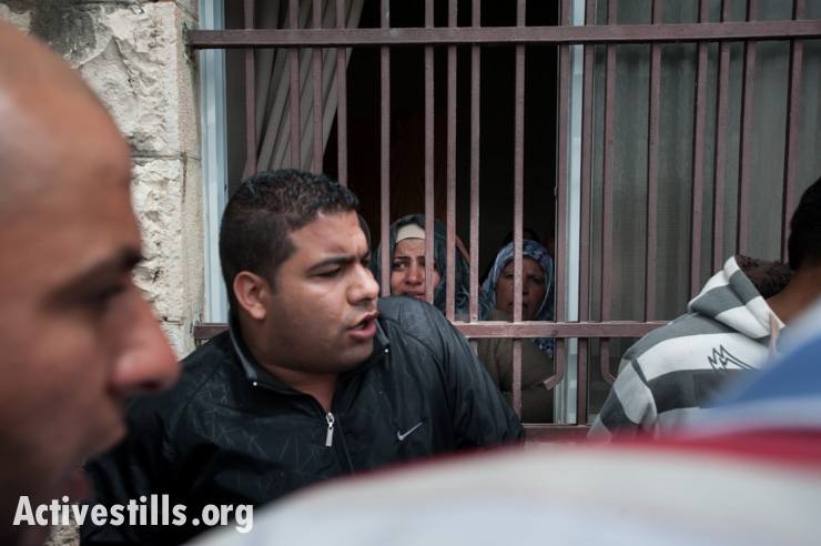 Family members carry the body of Noha Katamish from her home during her funeral in Aida Refugee Camp, West Bank, April 15, 2014. Noha Katamish, who had asthma, died from the effects of a tear gas grenade fired into her home by Israeli forces the previous day. She was the mother of one daughter.