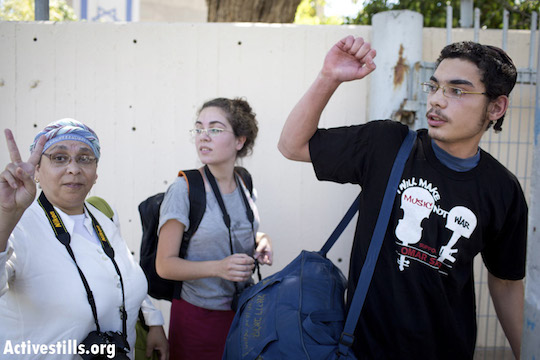 Uriel Ferera, a 19-year-old orthodox Jew from Beer Sheva, enters the Tel Hashomer military induction base, where he will officially announce his refusal to draft to Israeli army service, April 27, 2014. He is expected to be sentenced to military prison. (Photo: Activestills.org)
