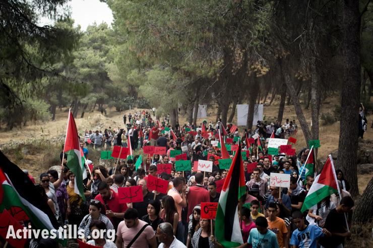 Some 15,000 Palestinian citizens of Israel take part in the March of Return to Lubya, a village in what is now northern Israel, which was destroyed in the Nakba of 1948. The event was held on May 6, 2014, the same day that Israeli Jews celebrate Independence Day. Nakba, Arabic for "catastrophe," is the term given to the forced displacement of some 750,000 Palestinian refugees from 500 communities by Zionist forces before, during and after the 1948 War.