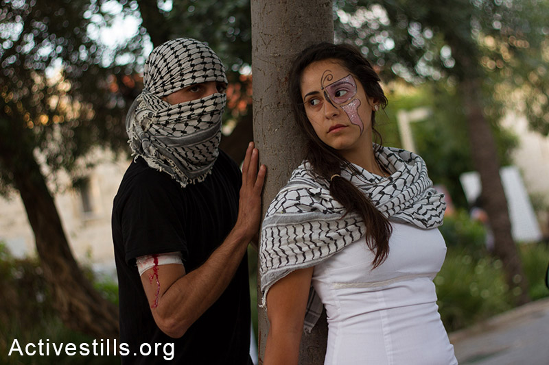 Palestinians living in Israel,  take part in an performance during an event against the plan to recruit Palestinians Christians to the Israeli army, in the city of Haifa May 17, 2014.(Activestills.org)