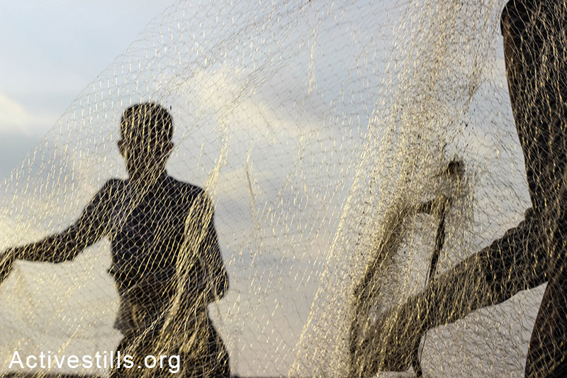 Palestinian fishermen prepare for sailing at Gaza seaport. (Basel Yazouri/Activestills.org)