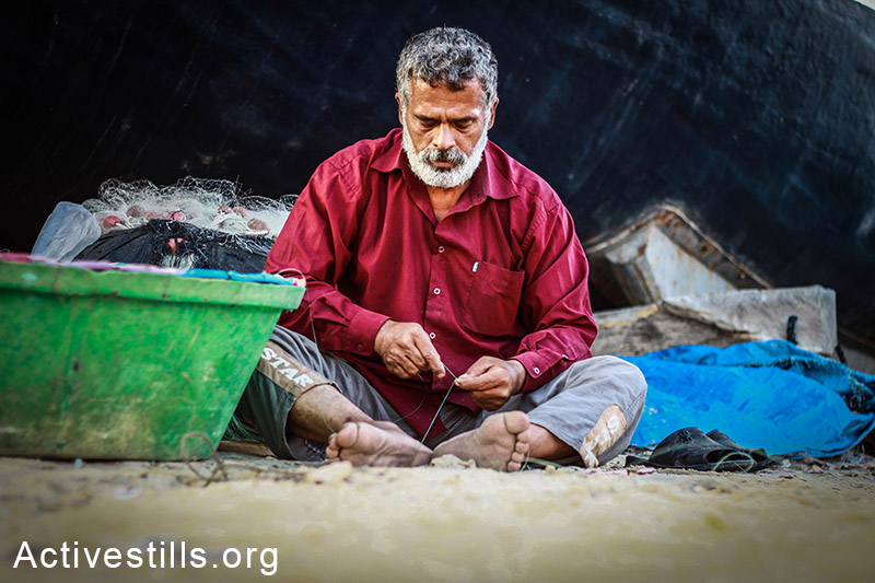 An old man makes fishing hooks by hand to sell to other fishermen. (Basel Yazouri/Activestills.org)