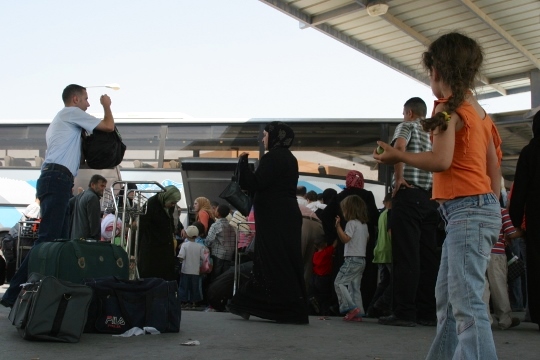 Palestinians wait at the Allenby bridge border crossing. (By Bassam Almohor)