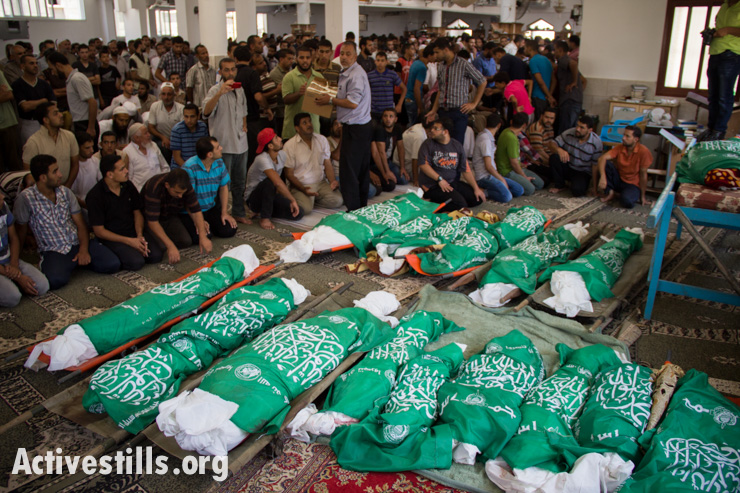 Mourners fill the mosque during the funeral for 24 members of the Abu Jamea family, who were killed the previous day during an Israeli attack over the Bani Suhaila neighborhood of Khan Younis, Gaza Strip, July 21, 2014. Reports indicate that 15 of the 24 killed were children of Abu Jamea family. 