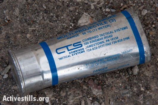 A spent tear gas grenade casing lies on the ground near Aida Refugee Camp following clashes between Palestinian youth and Israeli forces, Bethlehem, West Bank, November 29, 2013. 