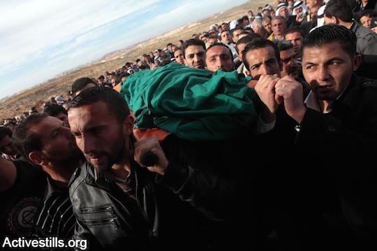 Funeral of Hamza Zayed Jaradat and Zayed Juma Jaradat, two 12-year-old Palestinian children killed by an unexploded mortar left behind by Israeli forces in the West Bank village of Sa'ir, near Hebron, March 7, 2012. (Photo by Anne Paq/Activestills.org)