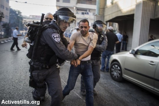 Police arrest an Arab protester during an anti-war demonstration in Nazareth. (photo: Activestills.org)