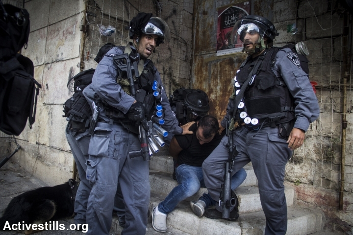Police arrest an Arab protester during a demonstration in Nazareth against the Gaza war. (photo: Activestills.org)