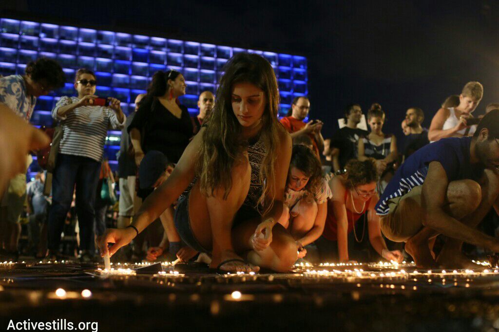 Israelis protesting the Gaza war in Tel Aviv light candles to commemorate the victims. (photo: Oren Ziv/Activestills.org)