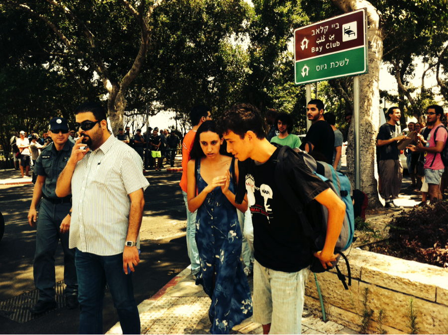 Udi Segal walks in the direction of the Draft Center in Haifa, where he will refuse to enlist. 