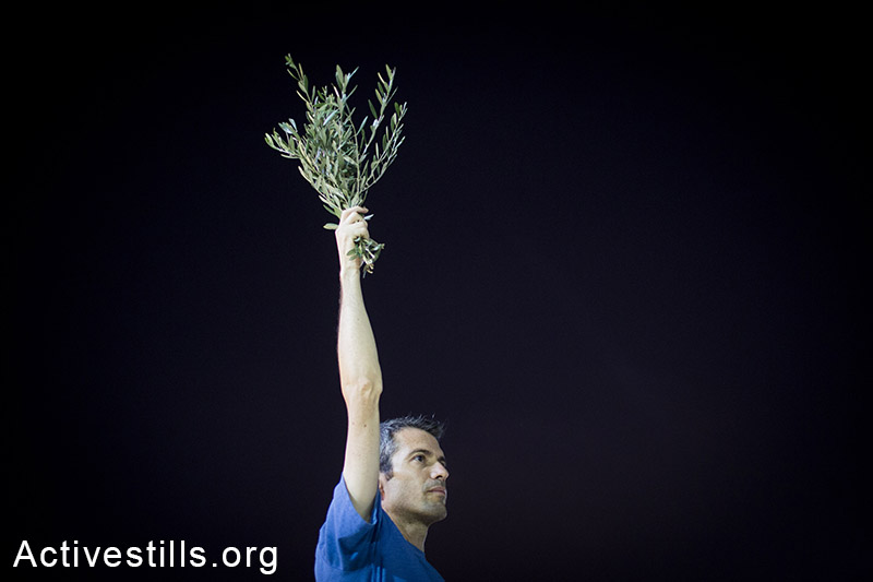 Israeli activists protest in centre Tel Aviv against the Israeli attack on Gaza, calling to end the violence, August 23, 2014. (Activestills.org)
