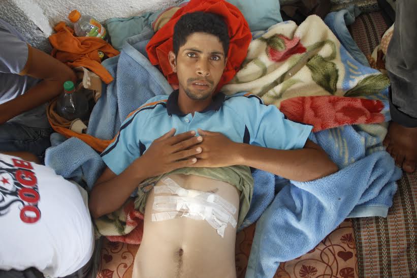 Salah Salameen and his cousin, both 24, were injured by shrapnel from the August 3 strike. They were discharged from the Kuwaiti Hospital the day of the attack because there were no beds left for them. (photo: Samer Badawi)