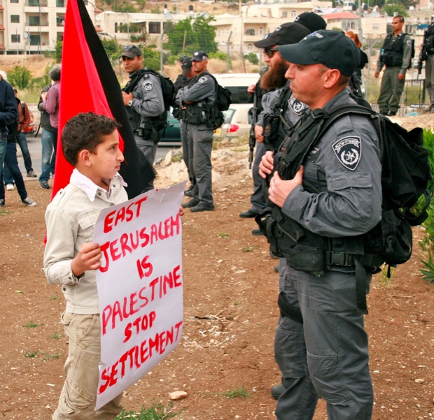 At a Sheikh Jarrah demonstration, a Palestinian boy confronts Israeli police. Credit: Lisa Goldman Palestinian boy confronts Israeli police at Sheikh Jarrah demo