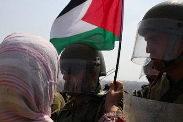 Demonstrators confronting IDF forces today in Bilin (photo: Hamde Abu-Rahma)