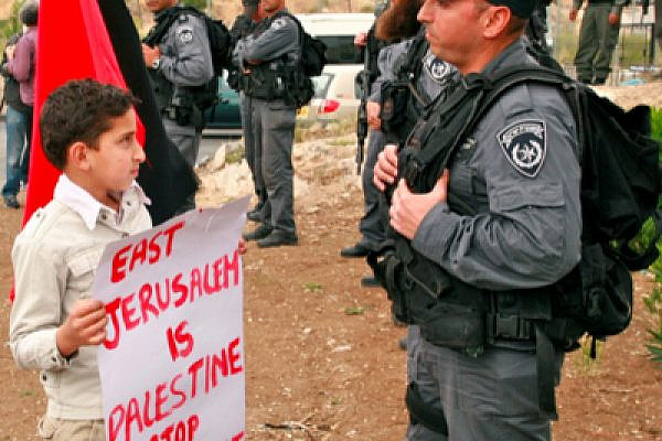 Palestinian boy demonstrating in Sheikh Jarrah (photo: Flickr/lisang)