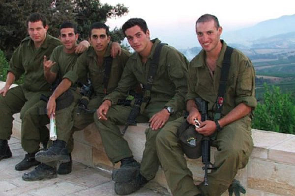 IDF soldiers posing in Metulla, near Lebanon, August 2006 (credit: Lisa Goldman)