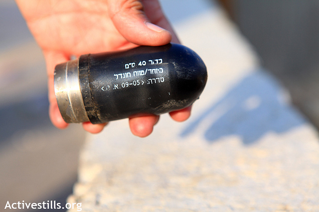 A high-velocity tear gas canister is seen during a demonstration in Nabi Saleh 12.11.2010. Photo by: Anne Paq/Activestills.org