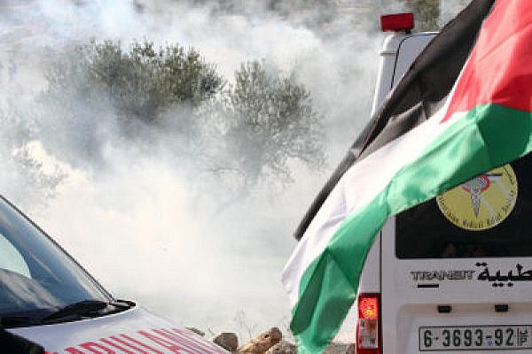 Ambulance under CS gas attack, Bil'in (Yossi Gurvitz)