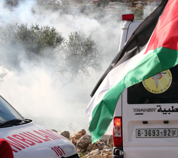 Ambulances under CS gas attack, Bil'in (Yossi Gurvitz)