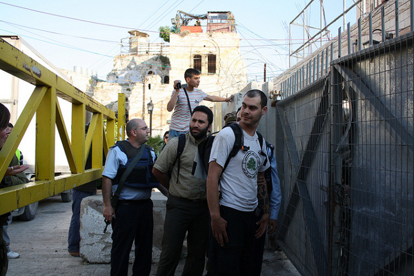 Issa Amro with Israeli activist Jonathan Pollak at a demonstration in Hebron last year. Photo: Joseph Dana