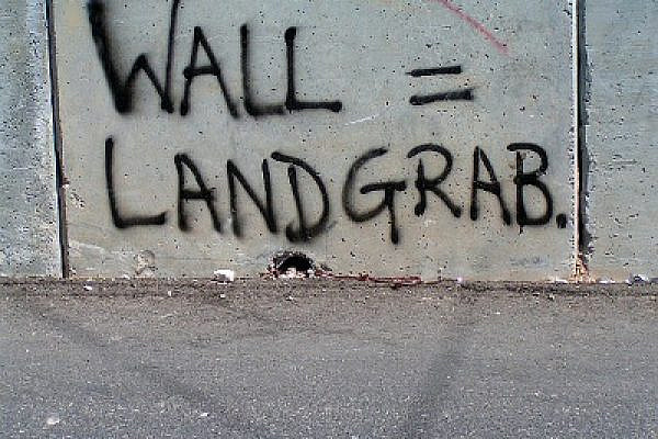 Graffiti "Wall=Landgrab," Abu Dis, September 2005 (Photo: Bright Tal (Political)/Flickr)