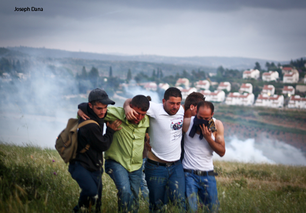 Palestinians suffer from Tear Gas in Nabi Saleh. Photo: Joseph Dana