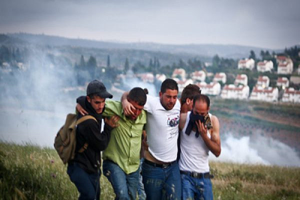 Palestinians suffer from tear gas in Nabi Saleh Photo: Joseph Dana