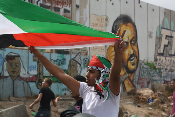 A Palestinian protester during clashes in Qalandia. Photo by Joseph Dana