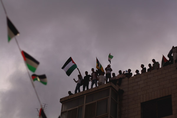 Palestinians take to the roofs of Ramallah in support of Abbas. Photo by Joseph Dana