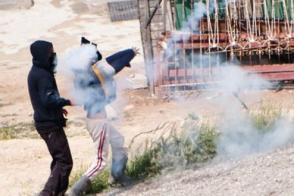 Illustrative photo of tear gas and Issawiya residents (photo: flickr/Activestills)