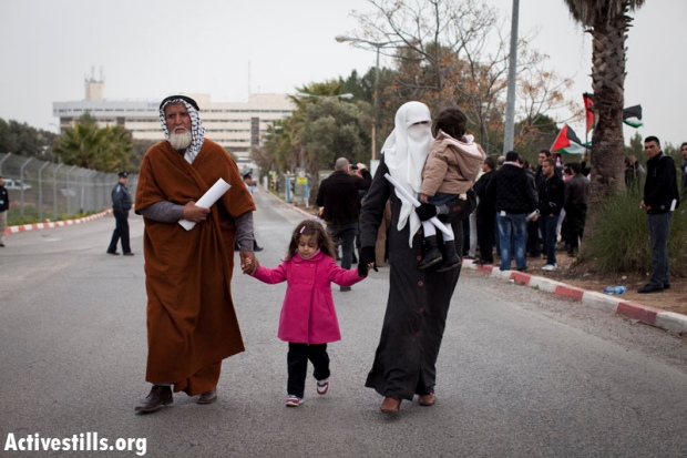 Khader Adnan's wife, daughters and father walk out of Ziv Hospital, after visiting Adnan, Safed, Israel, February 15, 2012. (photo: Oren Ziv/Activestills.org)