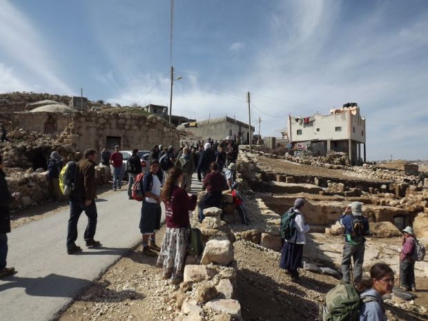 PHOTOS: Settlers march through Palestinian village