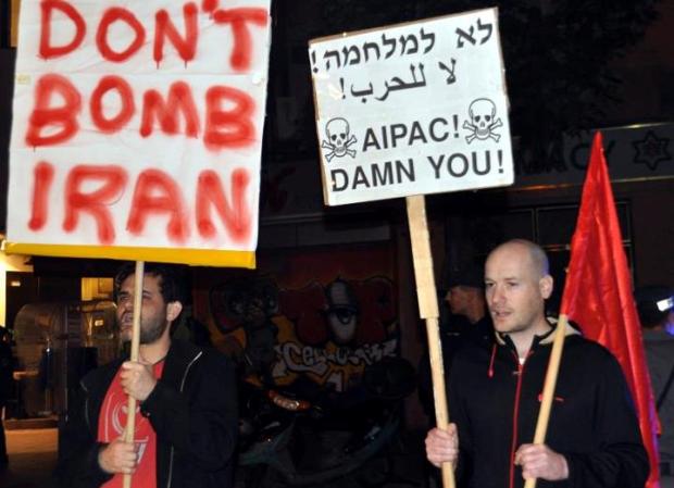 Anti-AIPAC signs in Tel Aviv rally against Iran war