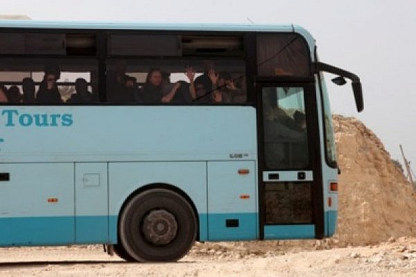 Harvard students on the bus in Al-Walaja (Anne Paq / Activestills)