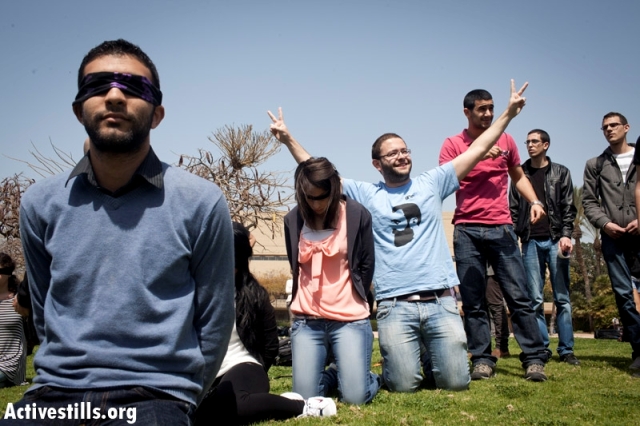 Im Tirzu activist fitting himself into a student protest in TAU for the release of Hana Shalabi (Oren Ziv / Activestills)