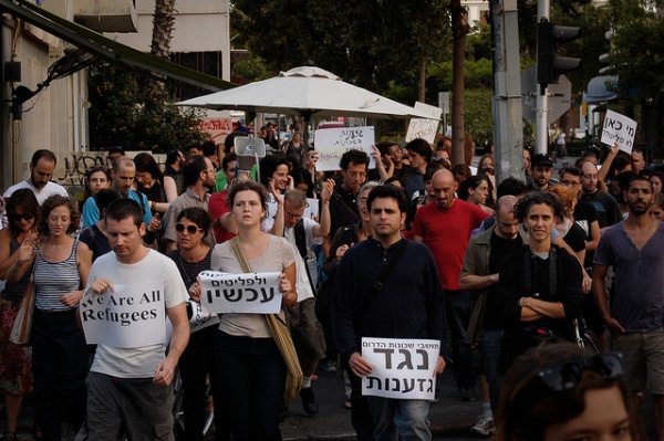 Marching in pain: Images from Tel Aviv's post-riot protest