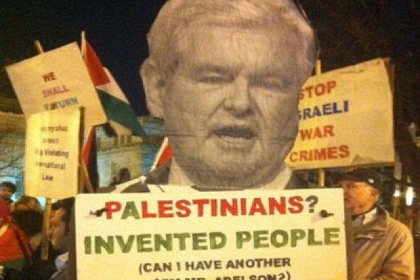 Protest sign outside 2012 AIPAC conference shows Gingrich asking, "Palestinians? Invented people (Can I have another $5M Mr. Adelson?)", Washington DC (photo: Roee Ruttenberg)