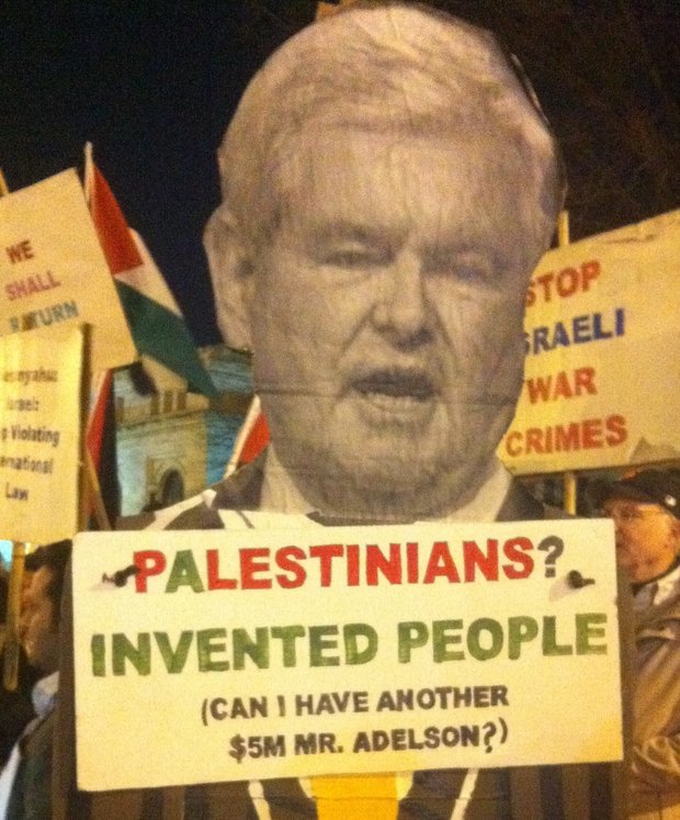 Protest sign outside 2012 AIPAC conference shows Gingrich asking, "Palestinians? Invented people (Can I have another $5M Mr. Adelson?)", Washington DC (photo: Roee Ruttenberg)