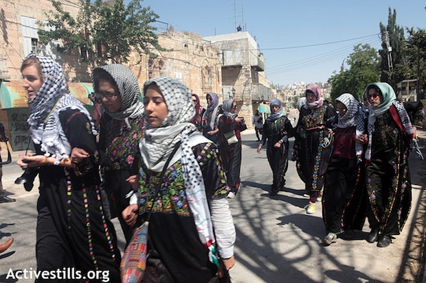 Women challenge segregation of Hebron street in direct action