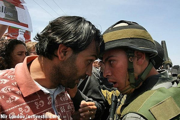 Confrontation between Palestinian and IDF soldier in Gush Etzion, 2007 (Activestills)
