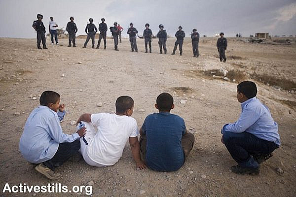Demolition of Al Arakib as children watch (Activestills)