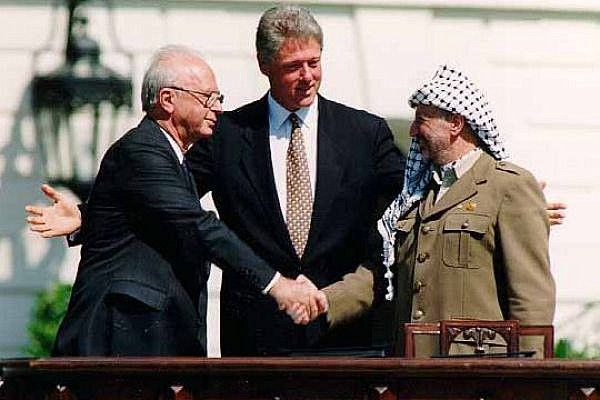 Israeli Prime Minister Yitzhak Rabin, U.S. president Bill Clinton, and PLO Chairman Yasser Arafat at the signing of the Oslo Accords at the White House on September 13, 1993. (Vince Musi/The White House)